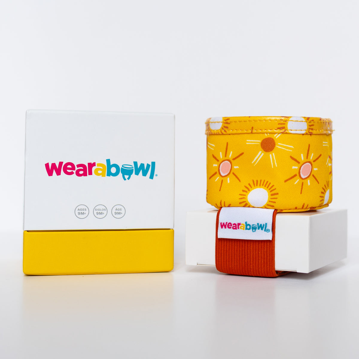 Yellow and red 'Wearabowl' product with packaging.